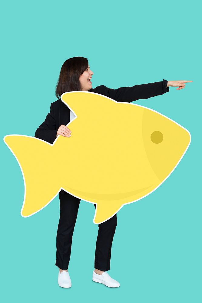 Businesswoman holding a big fish