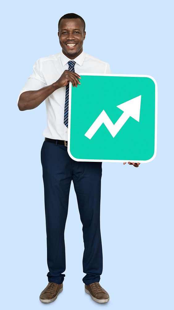 Man holding a growth indicating arrow