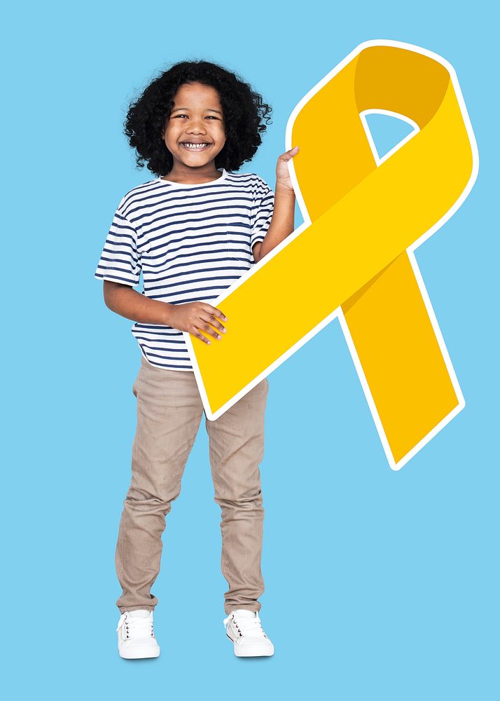 Young boy holding a golden ribbon supporting childhood cancer awareness