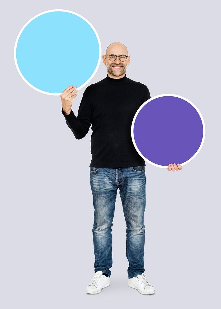 Man showing blank blue circle boards