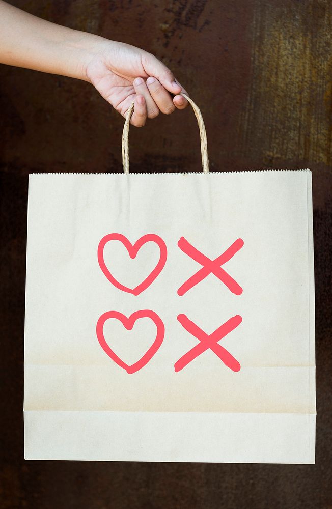 Hearts and kisses symbols on a paper bag