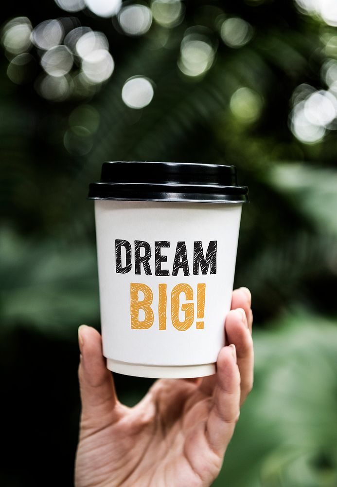 Wording Dream big on a paper coffee cup