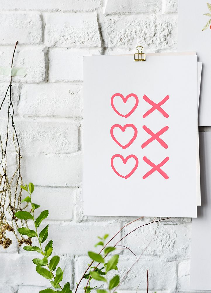 Hearts and kisses symbols poster on white wall
