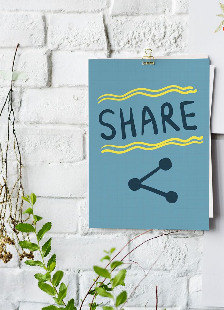 Share written on a paper poster on white wall