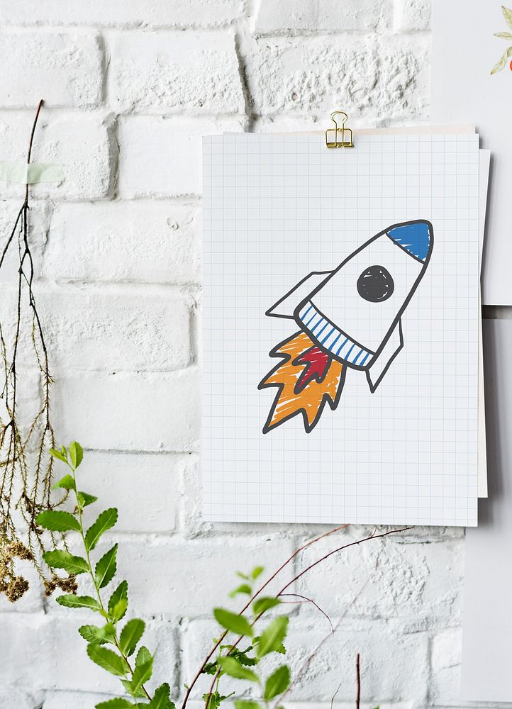 Rocket launch drawing on a paper poster on white wall