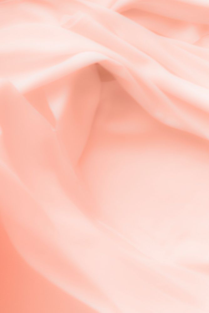 Peach rose petal colored fabric textile background