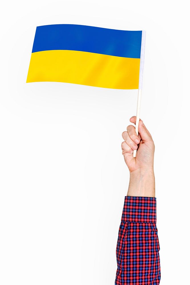 Ukraine's flag in hand collage element, Ukrainian symbol, isolated hand & object psd