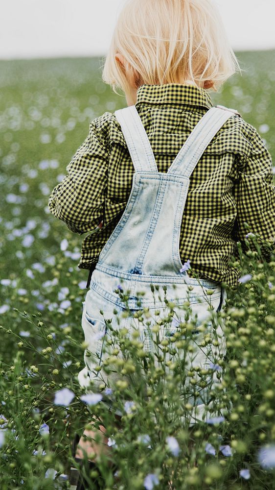 Spring mobile wallpaper background, kid in flower field