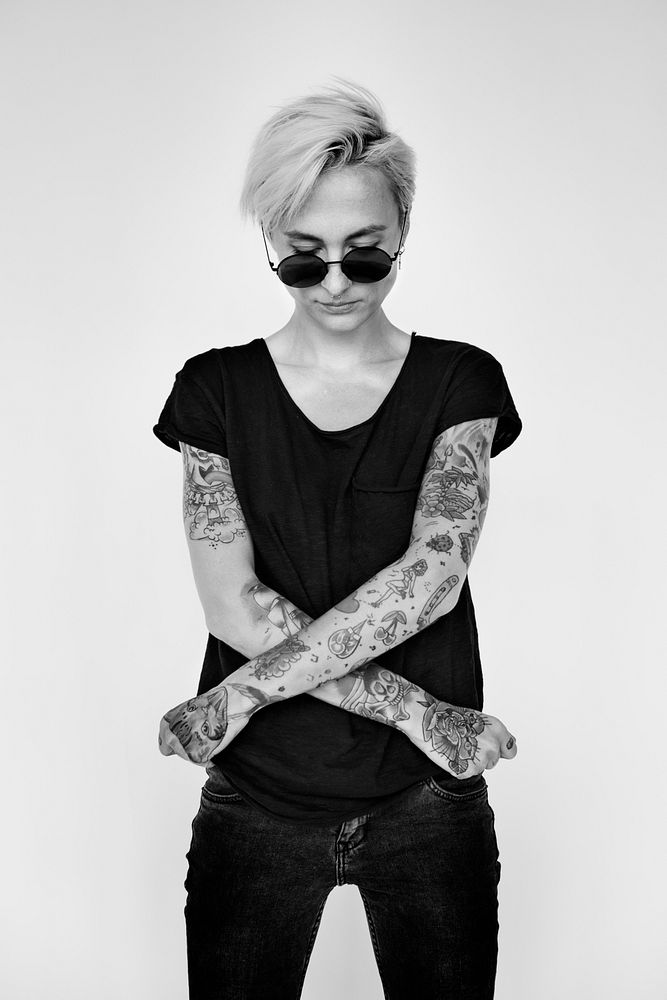 Tattooed woman in black tee grayscale