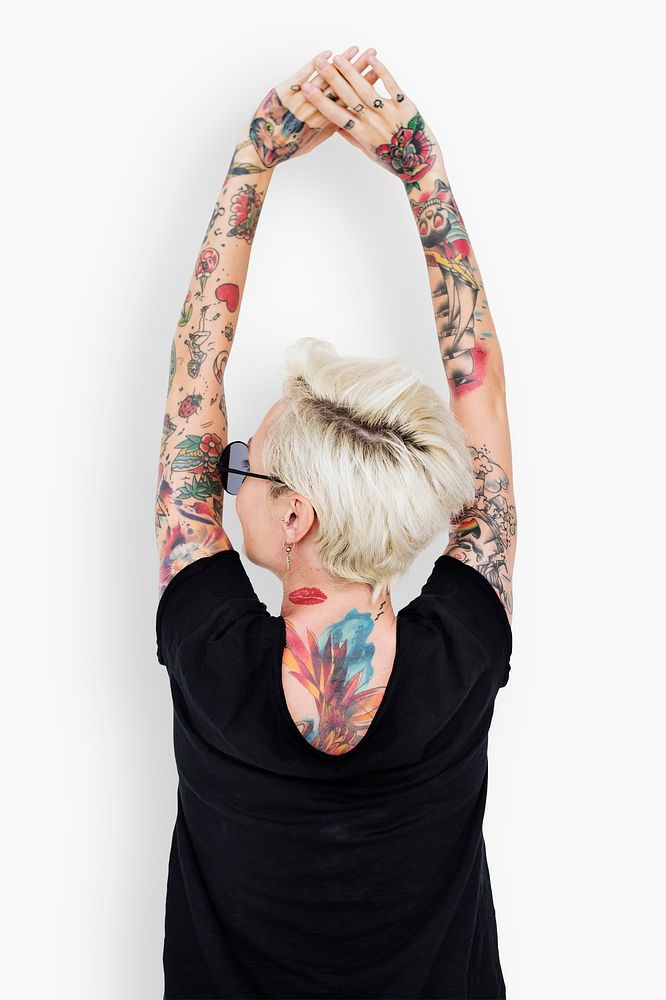 Back view of a cool woman with tattoos
