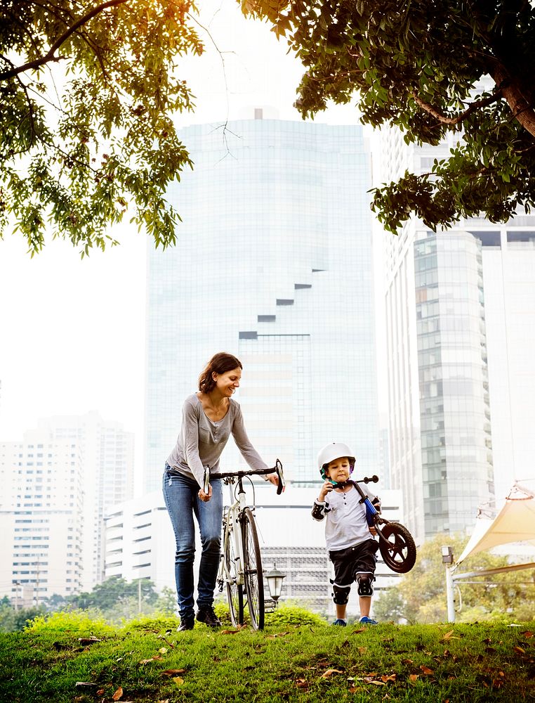 Mother and son cycling in the park