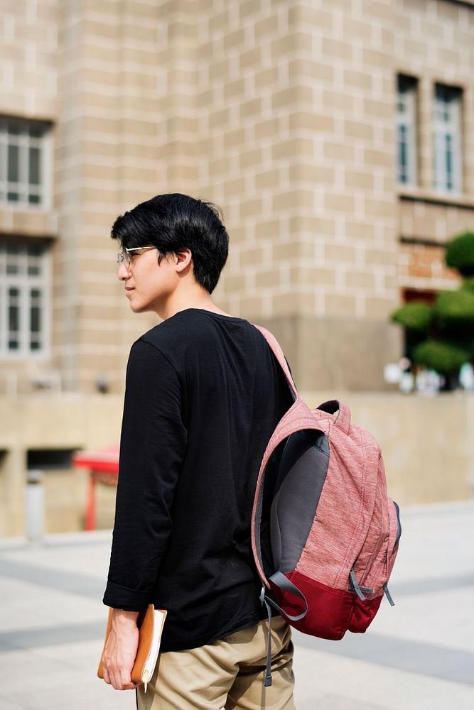 Young asian guy with a backpack