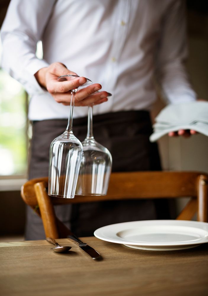 Restaurant Staff Setting Table in Restaurant for Reception