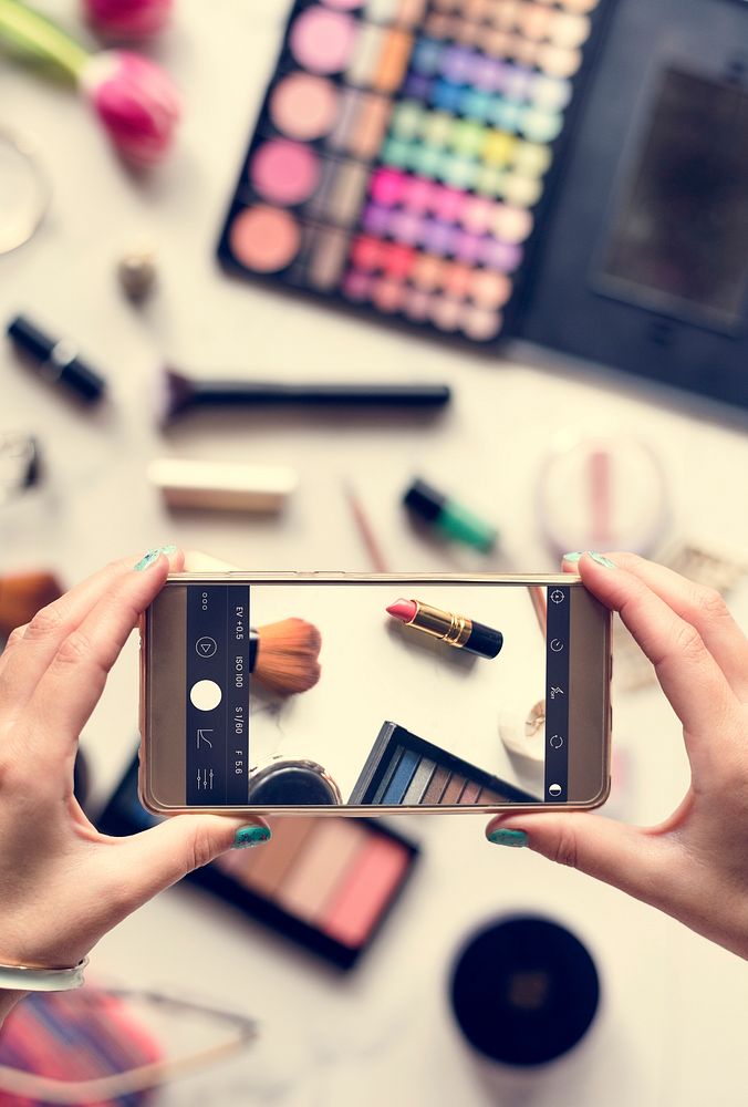 Woman Hands Using Mobile Phone Capture Photo with Cosmetics Back