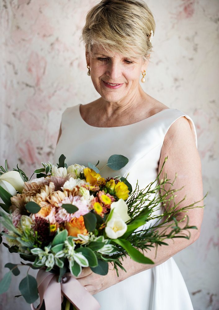 Senior Caucasian Bride Holding Flower Bouquet Wedding Engagement Ceremony