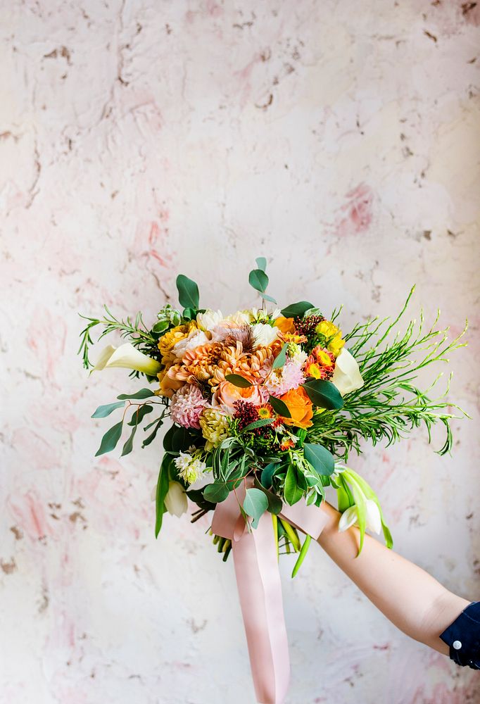 Hand Holding Fresh Real Flowers Bouquet