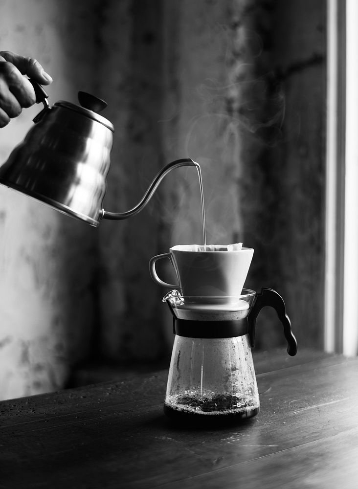 Barista hand dripping brewed coffee grayscale