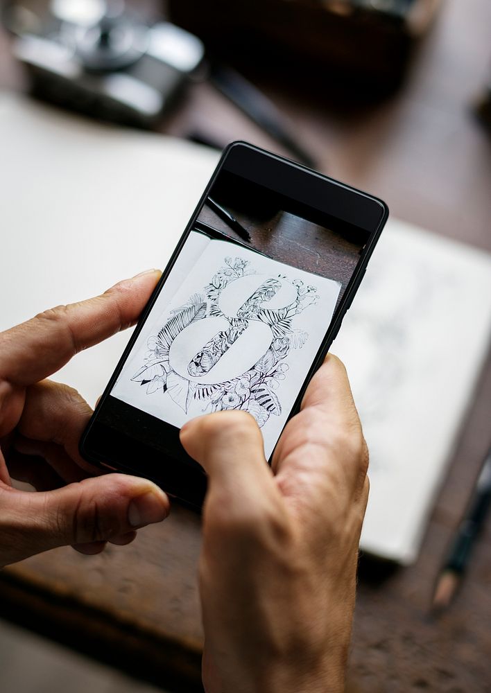 Closeup of mobile phone screen showing snap drawing art