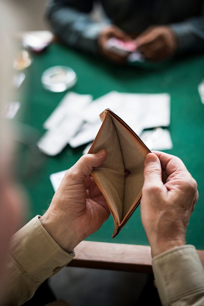 Adults socialising and playing cards 