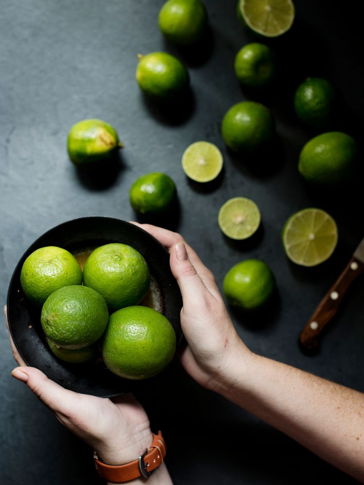 Closeup of hands with fresh lime