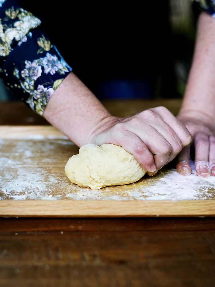 Close up of hands kneading dough for pastry