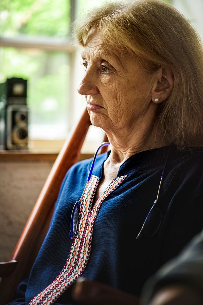 Side view of senior caucasian woman with thoughtful face expression