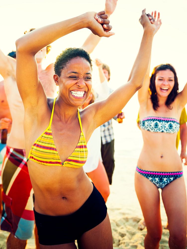 A group of diverse people is having fun at the beach