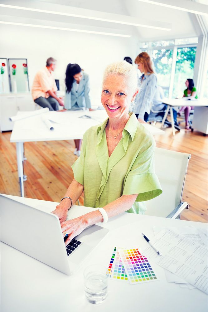 Old Businesswoman Working in the Office