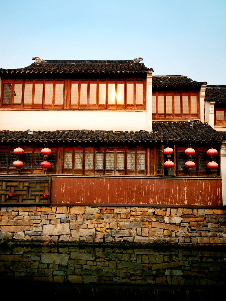 A traditional Chinese canal house basking in the late afternoon sun, Suzhou, China.