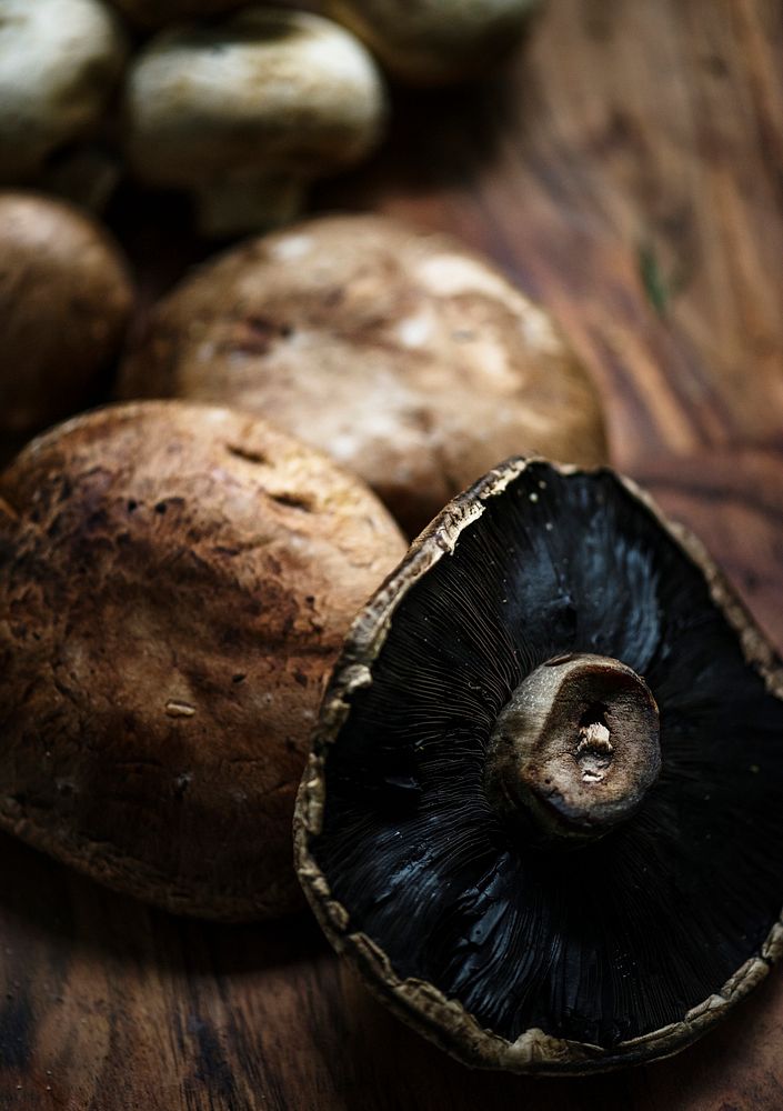 Closeup of portobello mushroom on wooden table