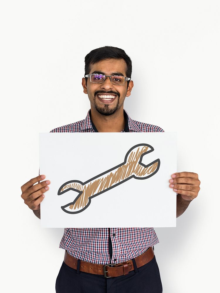 Indian guy holding placard with wrench icon