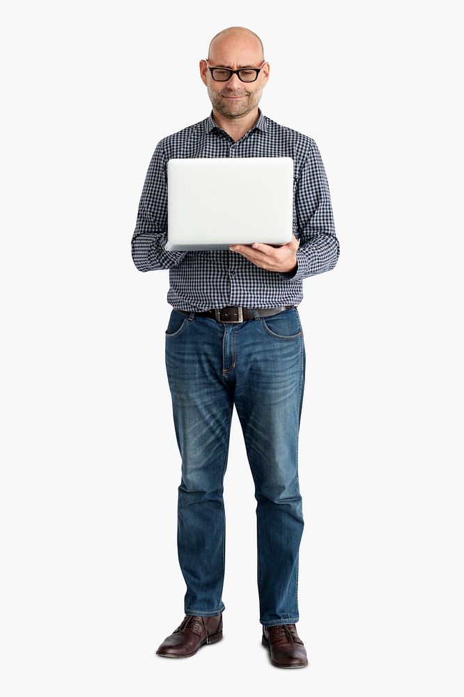 Casual man standing using a laptop