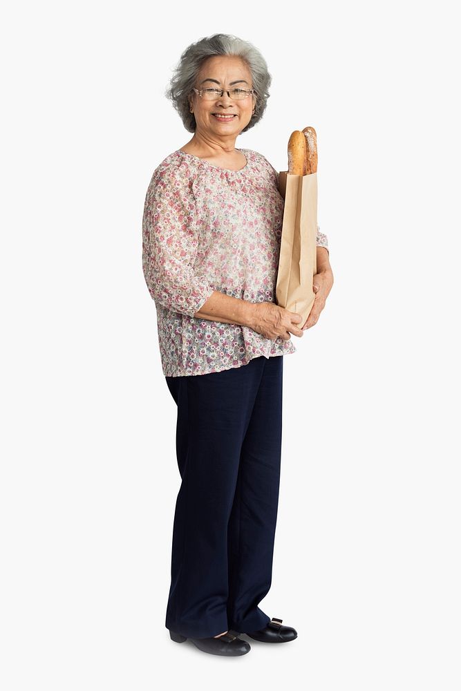 Senior adult woman holding a bag of bread