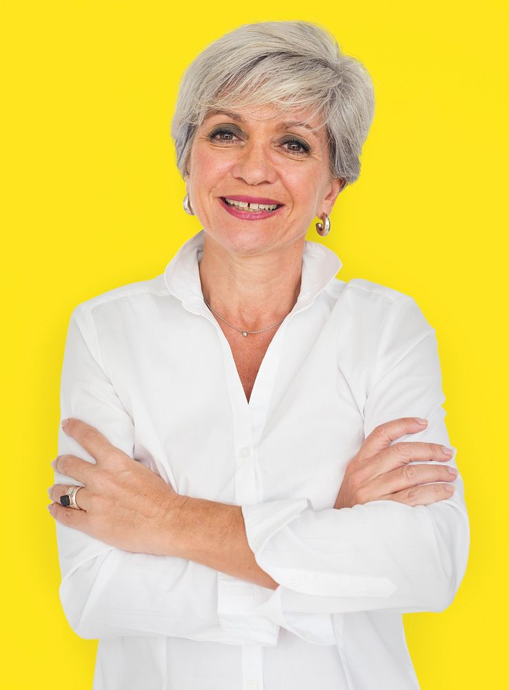 Senior woman smiling portrait with her arms crossed
