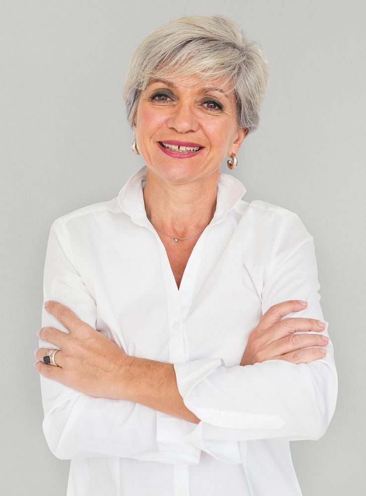Senior woman smiling portrait with her arms crossed