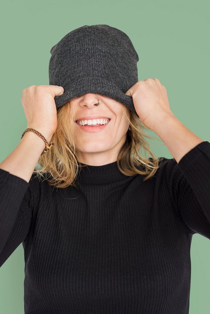 Caucasian Lady Beanie Covering Eyes Smiling