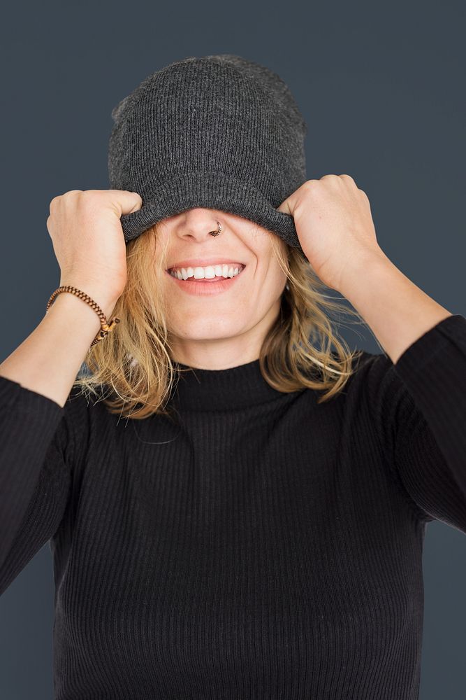 Caucasian Lady Beanie Covering Eyes Smiling