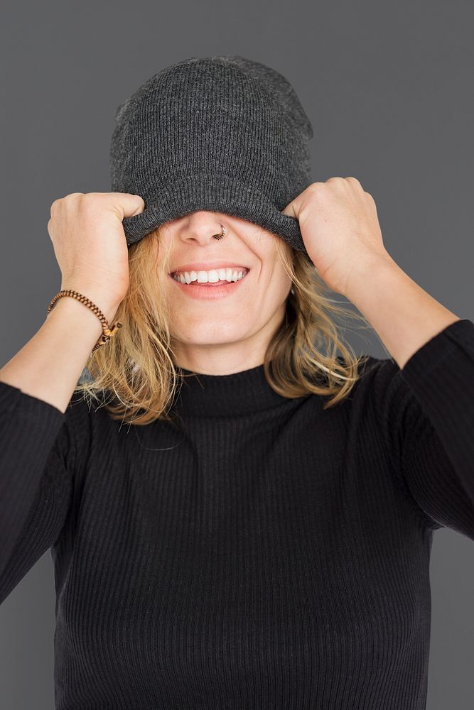 Caucasian Lady Beanie Covering Eyes Smiling