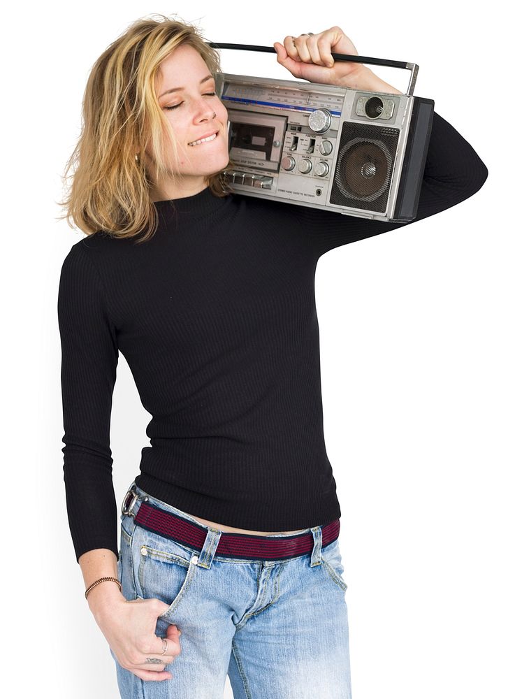 Woman listening to music from a boombox