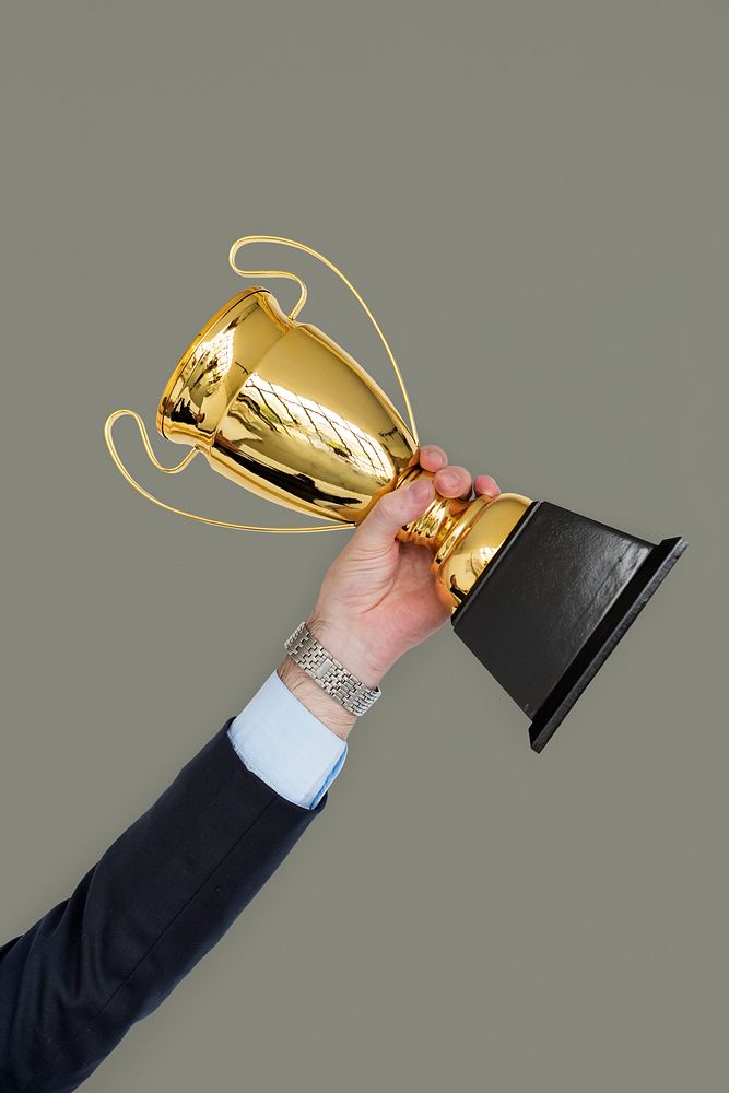 Business Man Holding Trophy