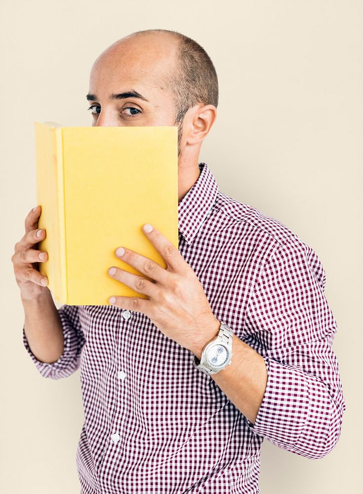 Man Holding Book Cover Mouth Concept