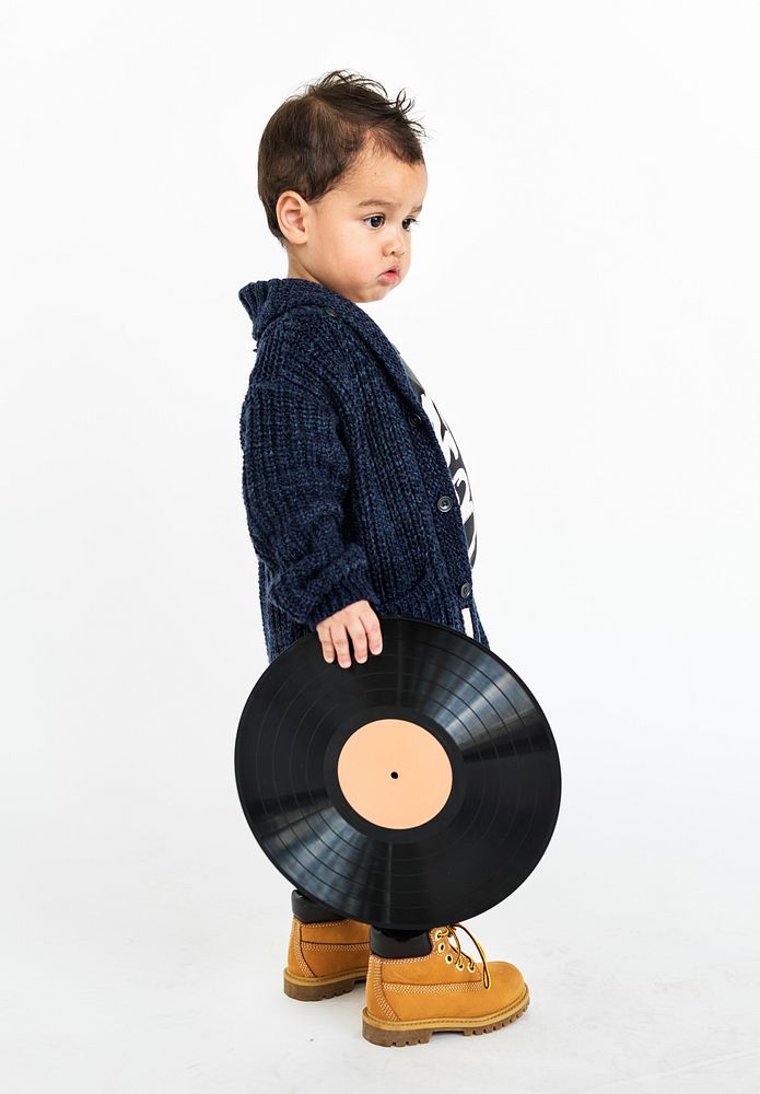 Little Boy Standing Holding Record Concept
