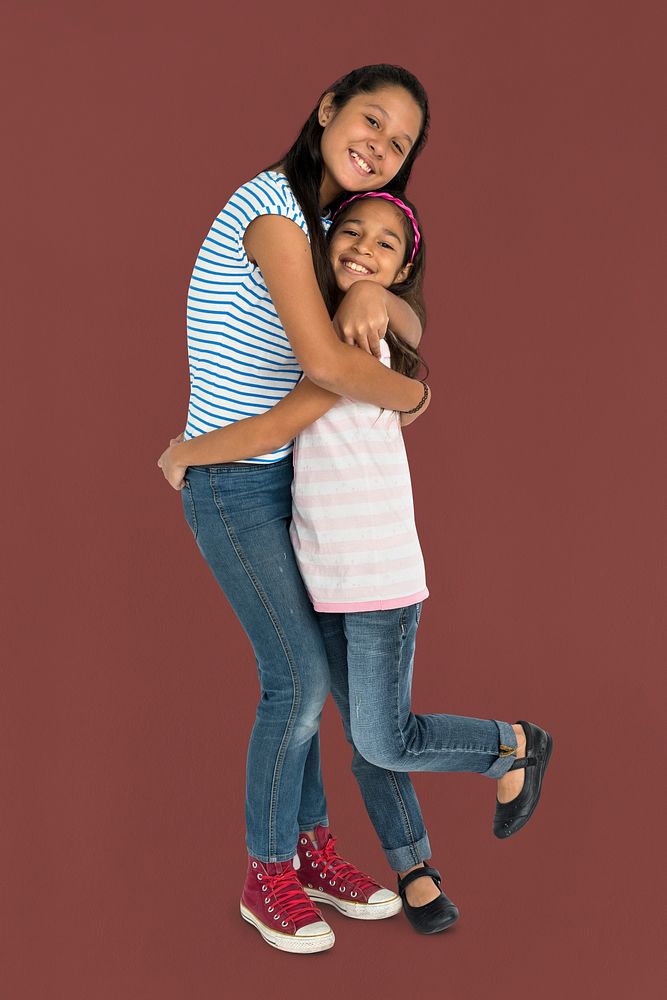Two Asian Girl Sisters Hugging Togetherness Concept