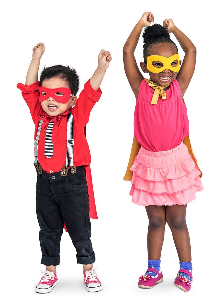 Little boy and girl wearing capes and masks