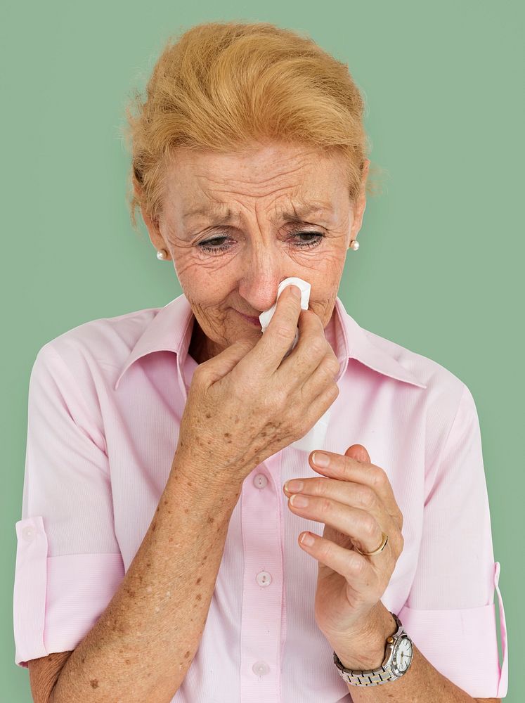 Senior Women Blowing Nose Concept