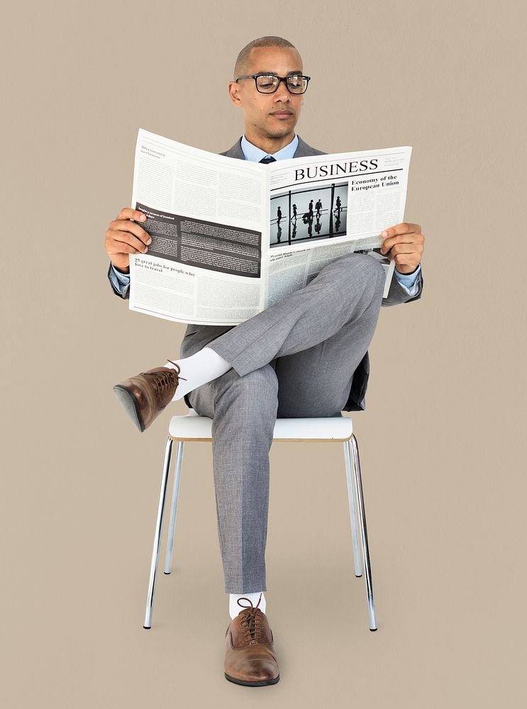 African Descent Business Man Reading Newspaper