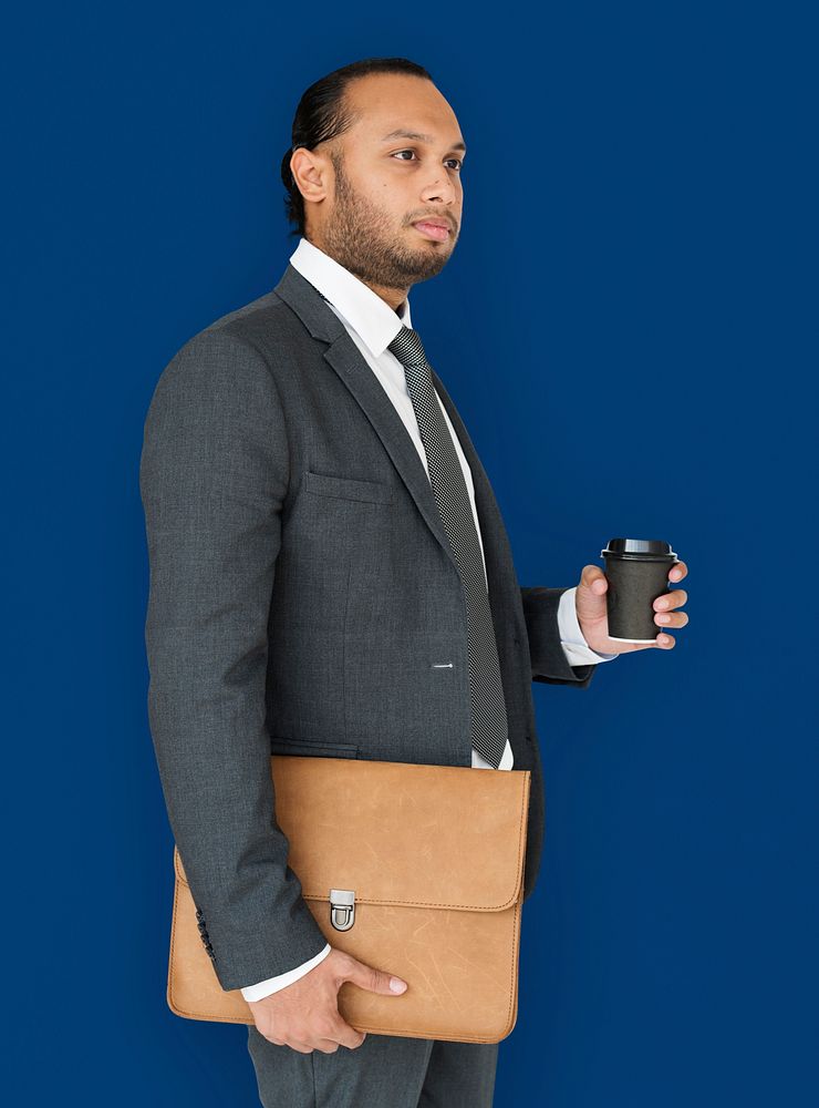 Indian Business Man Holding Bag and Coffee