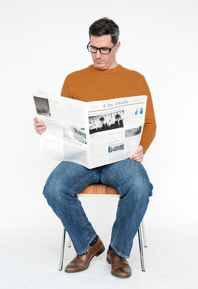 Portrait of a mature man reading the newspaper