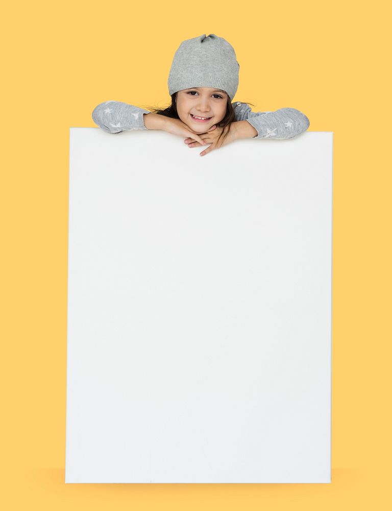 Girl resting her head on a big blank placard