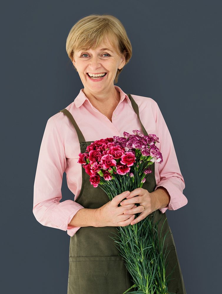 Senior Adult Woman Smiling Happiness Flower Studio Portrait